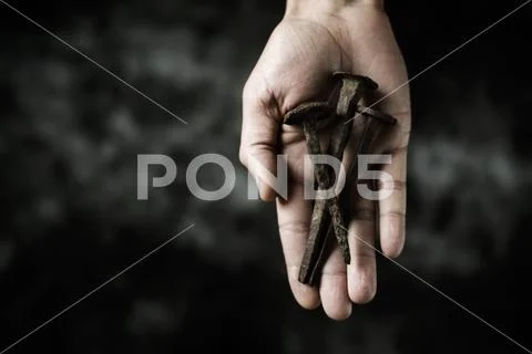 Rusty Nails On The Hand Of A Man