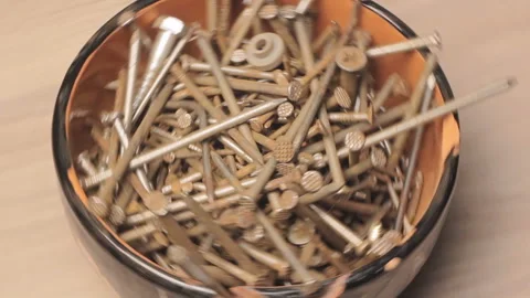 Rusty Nails Spinning Fast In The Broken Bowl (Looped Footage) Stock-Footage 104108315
