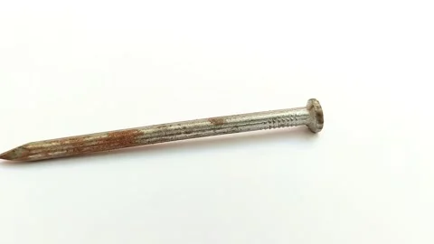 Rusty nails on a white background 스톡 동영상 313815230