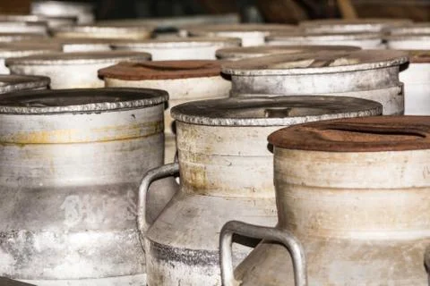 Rusty nostalgic milk cans Stock Photos