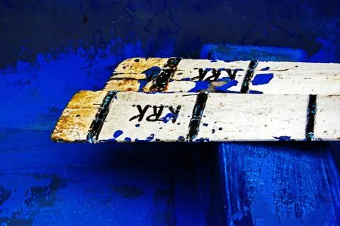 Rusty oars in a blue boat Stock Photos