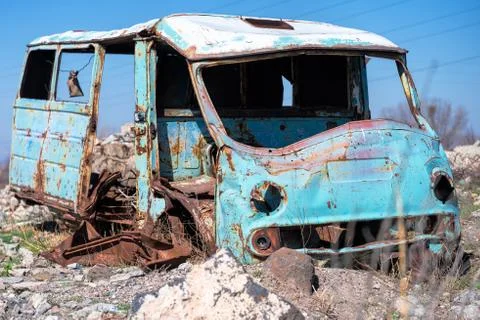 Rusty, old and abandoned Soviet Russian van out in the wasteland Stock Photos
