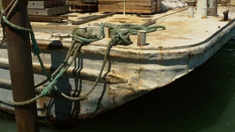 A rusty old barge gently rocks against its mooring, Pier 14, San Francisco Stock Footage 95540478