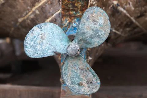 Rusty old boat propeller, close up photo Stock Photos