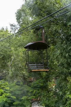 Rusty old cable car, cable car ride in the rain, views of the canyon, vegetation Stock Photos
