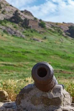 Rusty old cannon to fire nuclei. Stock Photos