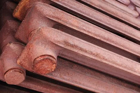 Rusty old cast-iron radiators lie in stack. industrial texture highlights sig 写真素材