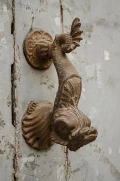Rusty old door knocker in shape of fish 스톡 사진