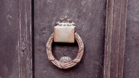 Rusty old door knocker on wooden door Stock Footage 273964153