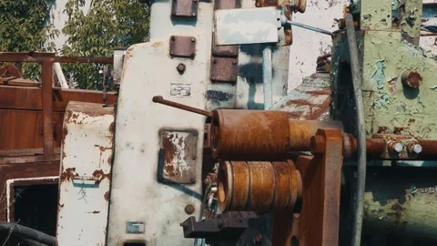 Rusty old-fashioned lathe, paint peeling under the sun and rain. Outdated Stockbeeldmateriaal 162571694