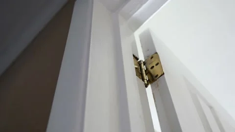 Rusty Old Golden Hinges Operating on Door Stock Footage 171018061