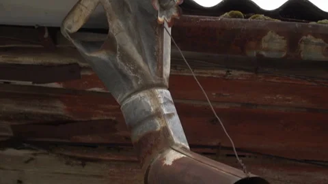 Rusty old hand shaped metal gutter detail Stock Footage 331799546
