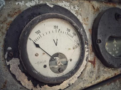 Rusty old large voltmeter Stock Photos