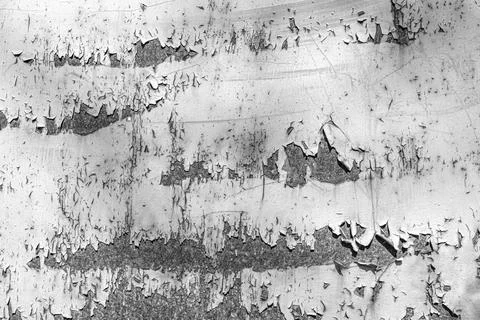 Rusty old metal texture with peeling paint as abstract background. Stock Photos