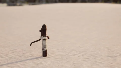 Rusty old metal water pump on sand beach Stock Footage 232992999