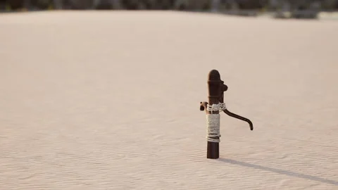 Rusty old metal water pump on sand beach Stock Footage 237328732