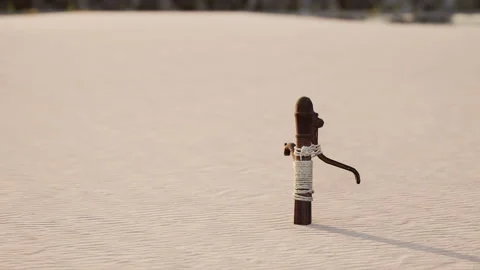 Rusty old metal water pump on sand beach Stock Footage 239409195