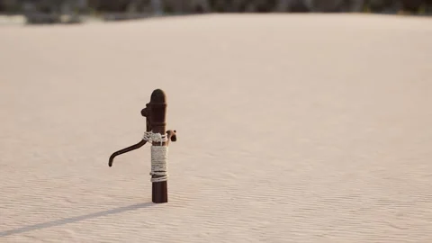 Rusty old metal water pump on sand beach Stock Footage 249957176