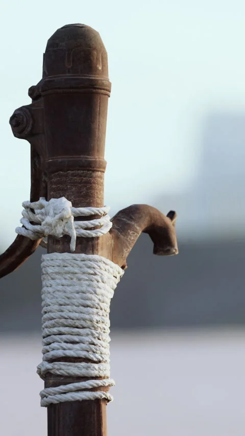 Rusty old metal water pump on sand beach Stock Footage 268988209