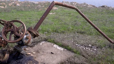 Rusty old oil pipe and valves - Panning shot Stock-Footage 88259224
