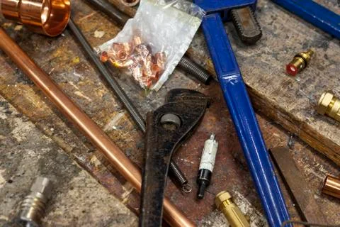 Rusty old pair of plumbers grips on a workbench Stock Photos