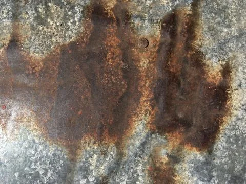 Rusty, old, rough, metal texture. Dark rusty metal texture background for int Stock Photos