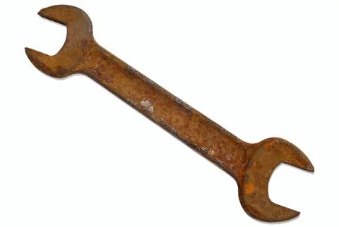 Rusty old spanner isolated on a white background. Photos