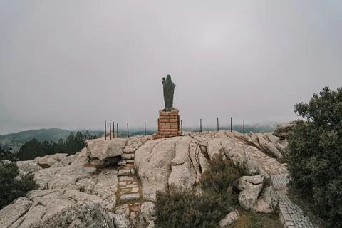 A rusty old statue of the madonna Stock Photos