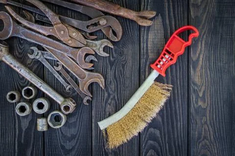Rusty Old Tools on black vintage wood background. Stock Photos