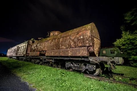 Rusty old train wagon at night Foto stock