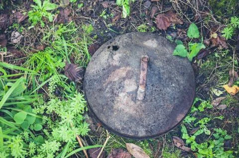 Rusty old trashcan lid 스톡 사진