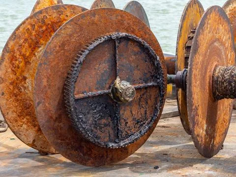 Rusty, old winch drums Stock Photos