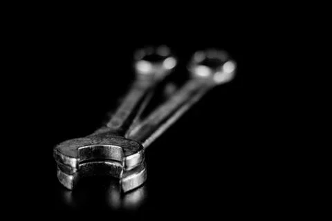 Rusty, old workshop keys. Hydraulic keys on a black table in a workshop. Blac Stock Photos