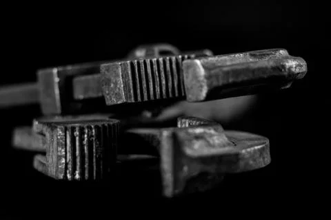 Rusty, old workshop keys. Hydraulic keys on a black table in a workshop. Blac Stock Photos