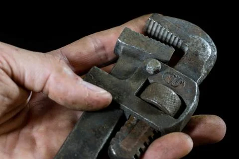 Rusty, old workshop keys. Hydraulic keys on a black table in a workshop. Blac Stock Photos