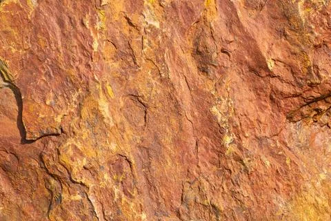 Rusty Orange color stone texture Background. Decorative Rock stone textures. Stock Photos