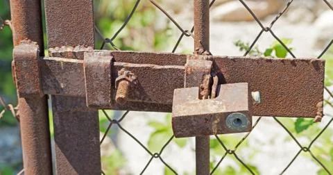 Rusty padlock on a door Stock Photos