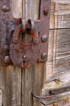 Rusty padlock on the gate Stock Photos