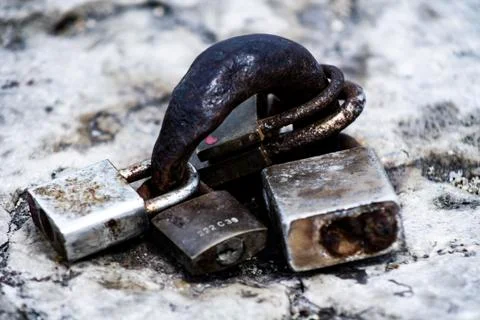 Rusty padlocks abandoned on the pier Stock Photos