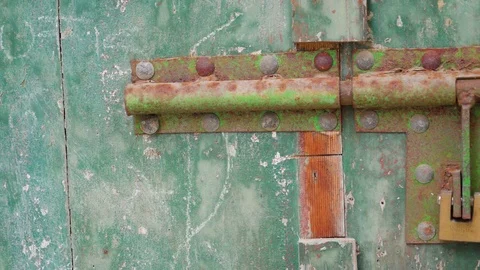 The rusty padlocks of the big door Stock Footage 83367360