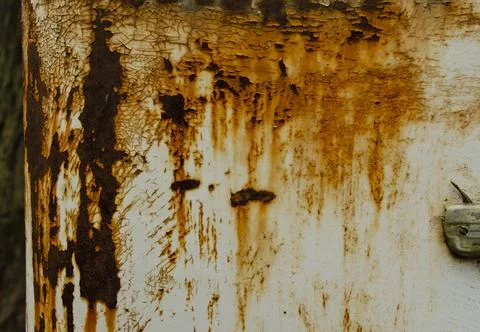 Rusty painted metal background with rust stains. Abstract background with cra Stock Photos