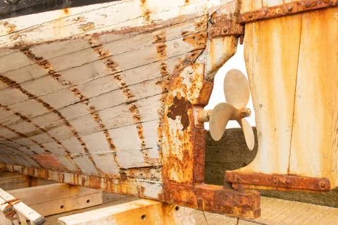 Rusty part of the back of a boat, also known as the aft or stern. Stock Photos