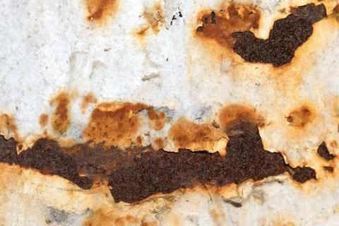 Rusty peeling painted metal background wall with rust spots. Stock Photos