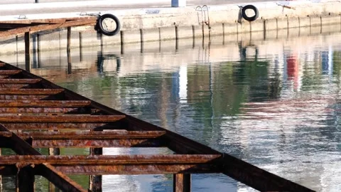 The rusty pier with mediterranean waves. Stock Footage 268902617