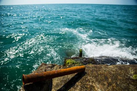 Rusty pipe on the background of Moss and sea Stock Photos