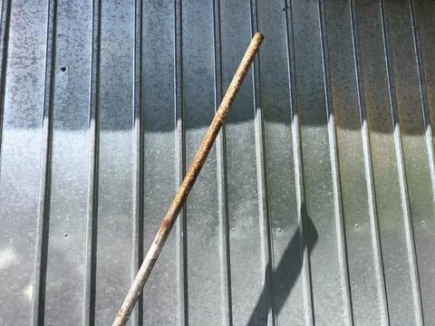 A rusty pipe on an industrial background. Stock Photos
