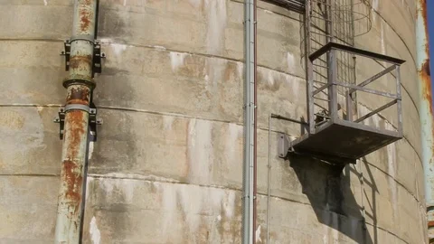 Rusty pipes and side tower Stock Footage 84928293