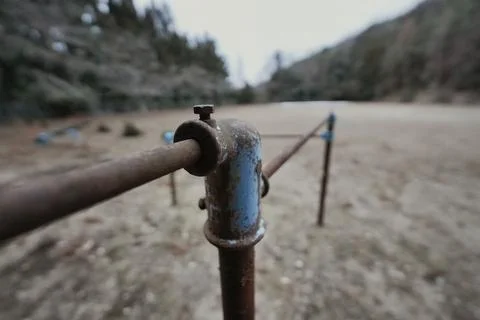 Rusty Playground Bar in an Empty Open Space – Time Standing Still Stockfoto's