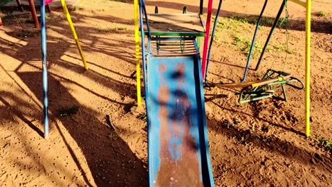 Rusty playground slide and swing set in warm sunlight Asuncion Paraguay 4K 3 스톡 동영상 319164438