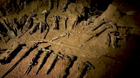 Rusty Pneumatic Drills Lined Up on Mine Tunnel Floor, Slow Pan Stock Footage 345644072